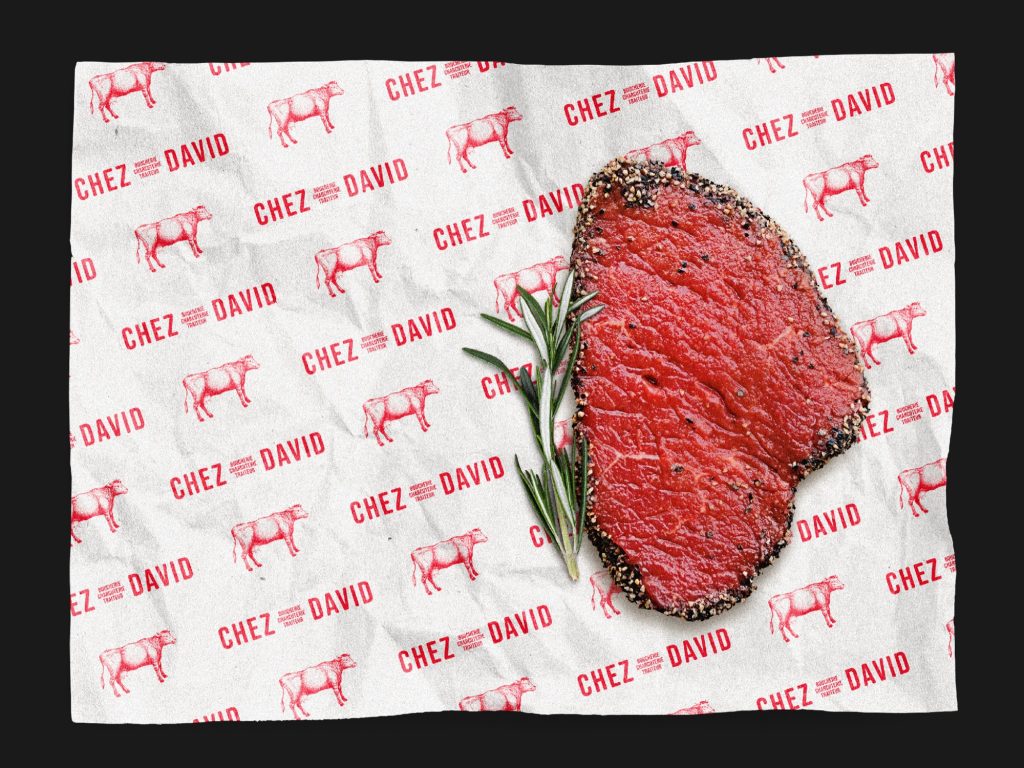 Papier boucher à motifs Chez David avec un steak poivré et du romarin